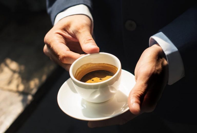 a-businessman-having-coffee-PZ36CMW