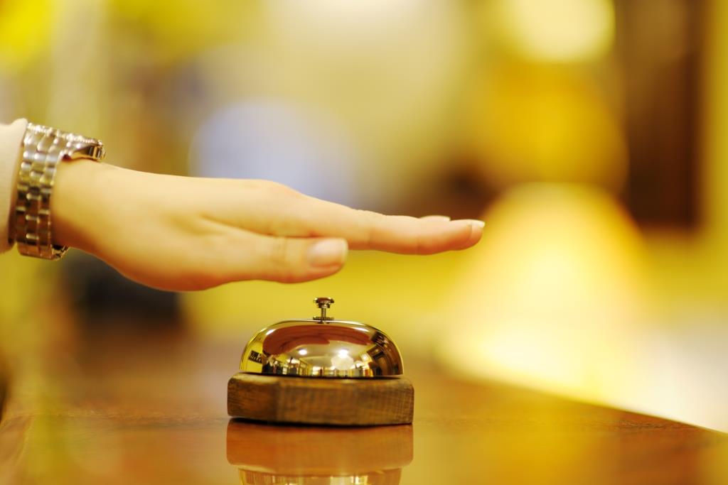 business woman  at the reception of a hotel checking in